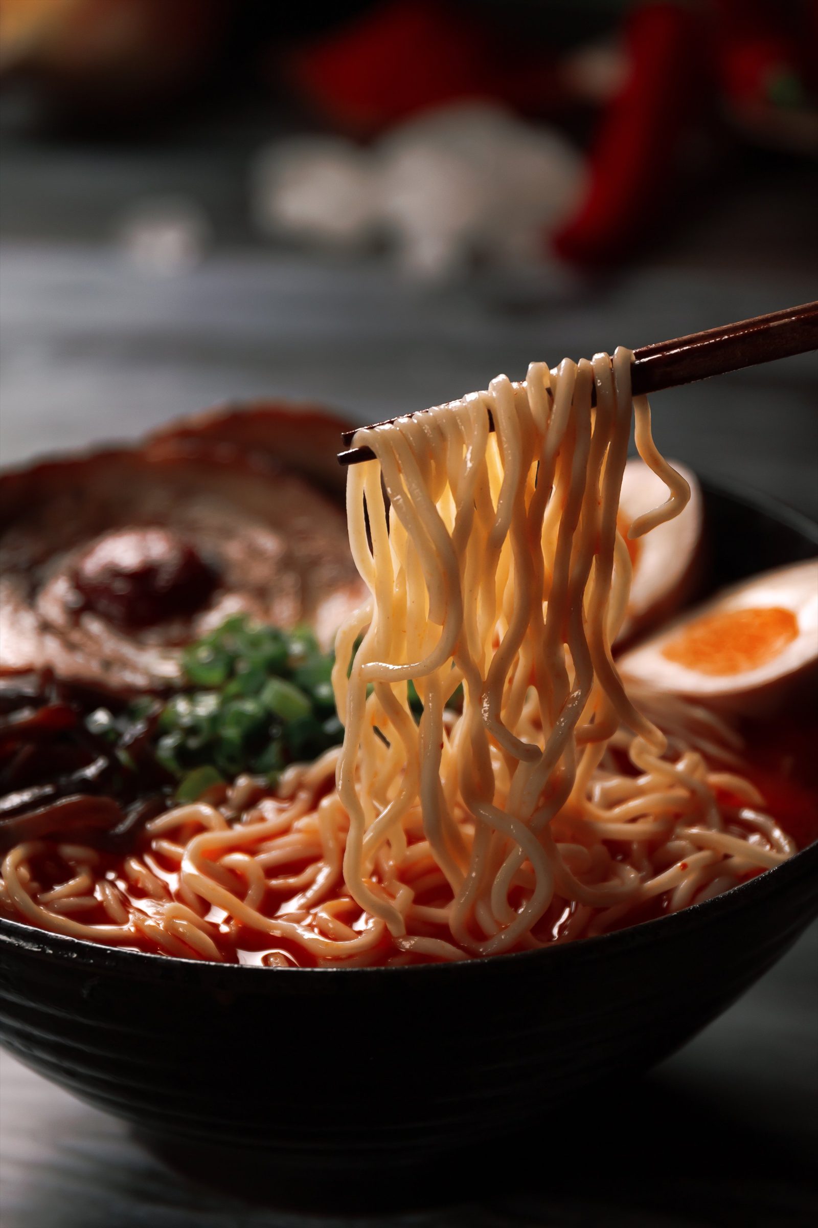 Noodle pull from a spicy ramen bowl at Ramen Mob PJ