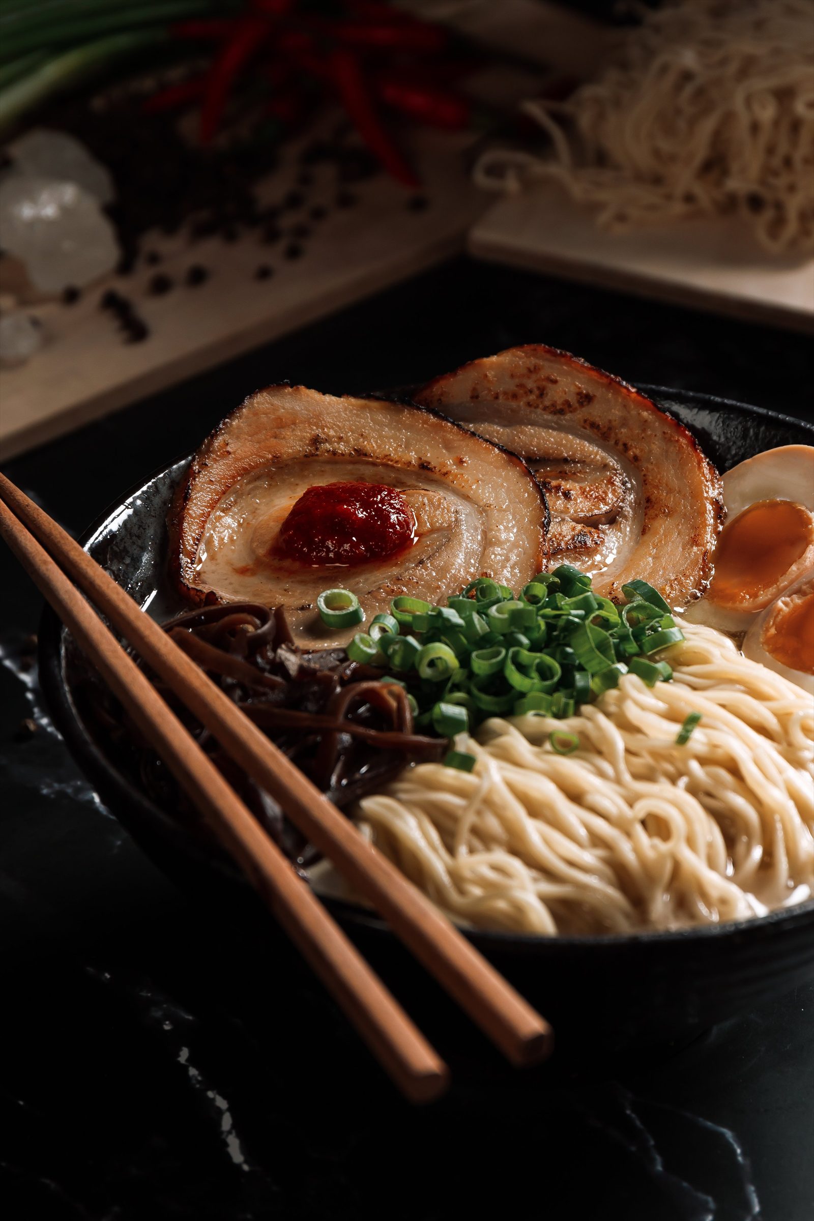 Shiro chashu ramen with spicy nikumiso, ajitama and chopsticks at Ramen Mob