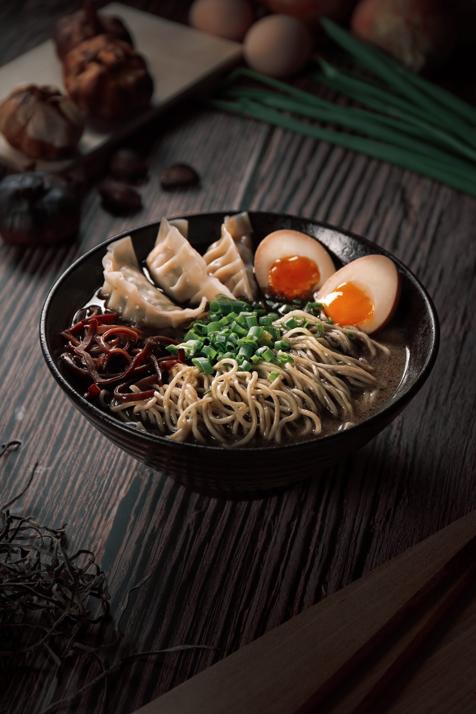 Steamed gyoza ramen with black garlic and ajitama at Ramen Mob